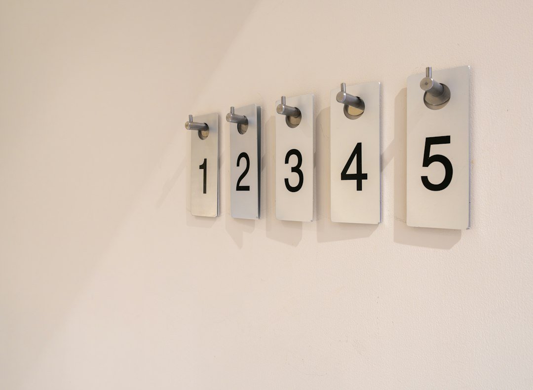Numbered wall hooks ready to hold cruise cabin gear