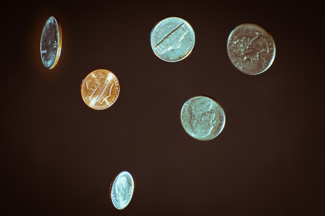 Close-up of coins on a dark background
