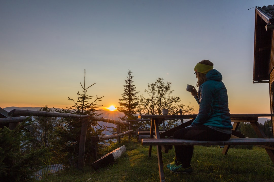 Steam rising from a morning coffee cup at sunrise at camp