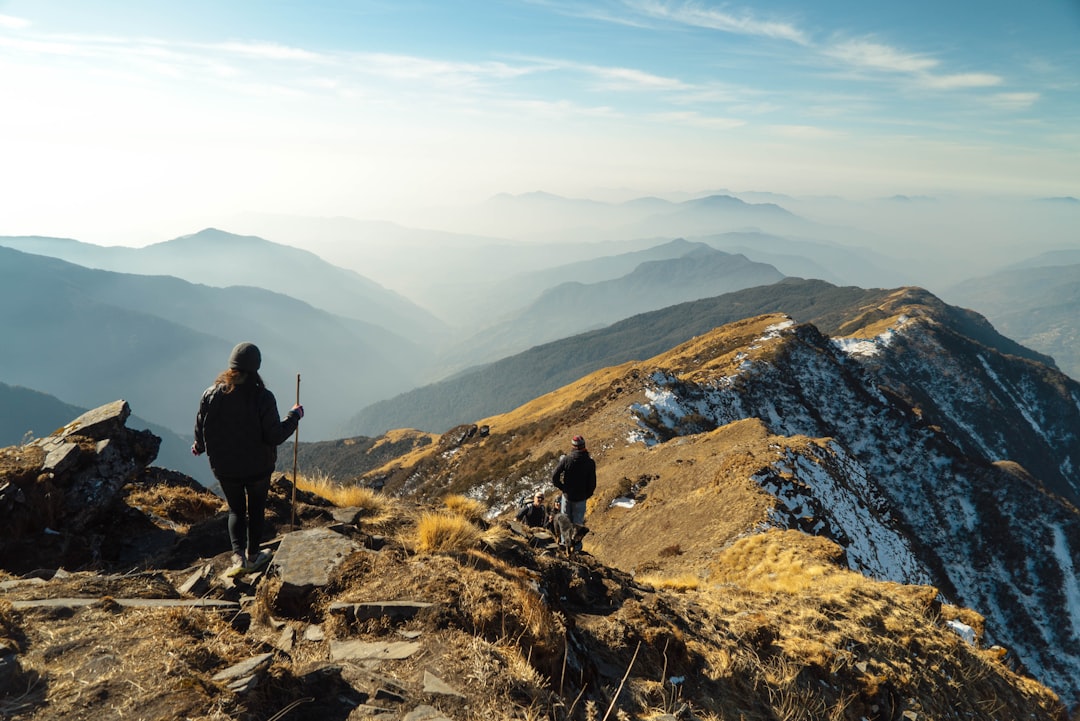 Hikers layered on a cold misty ridge