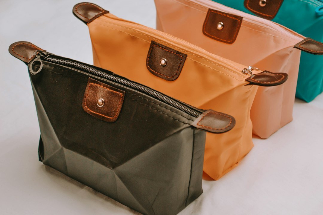 Colorful hanging toiletry bags organized for travel