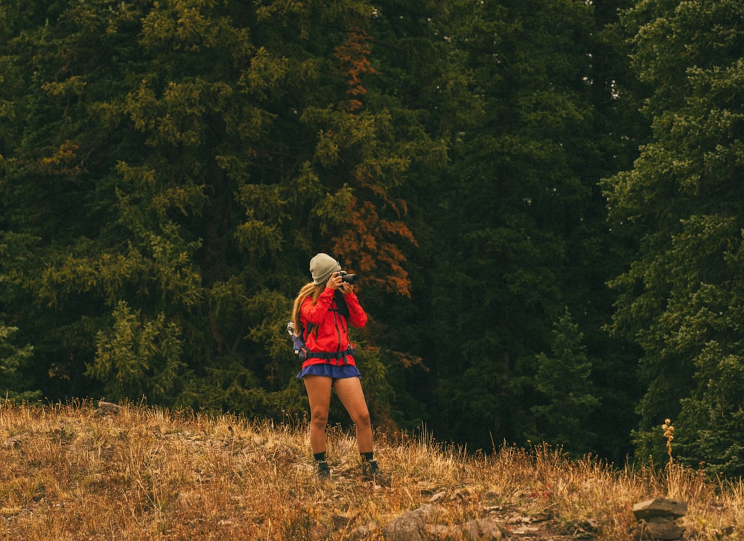 Camera bag packed and set on a mountain trail before a hike