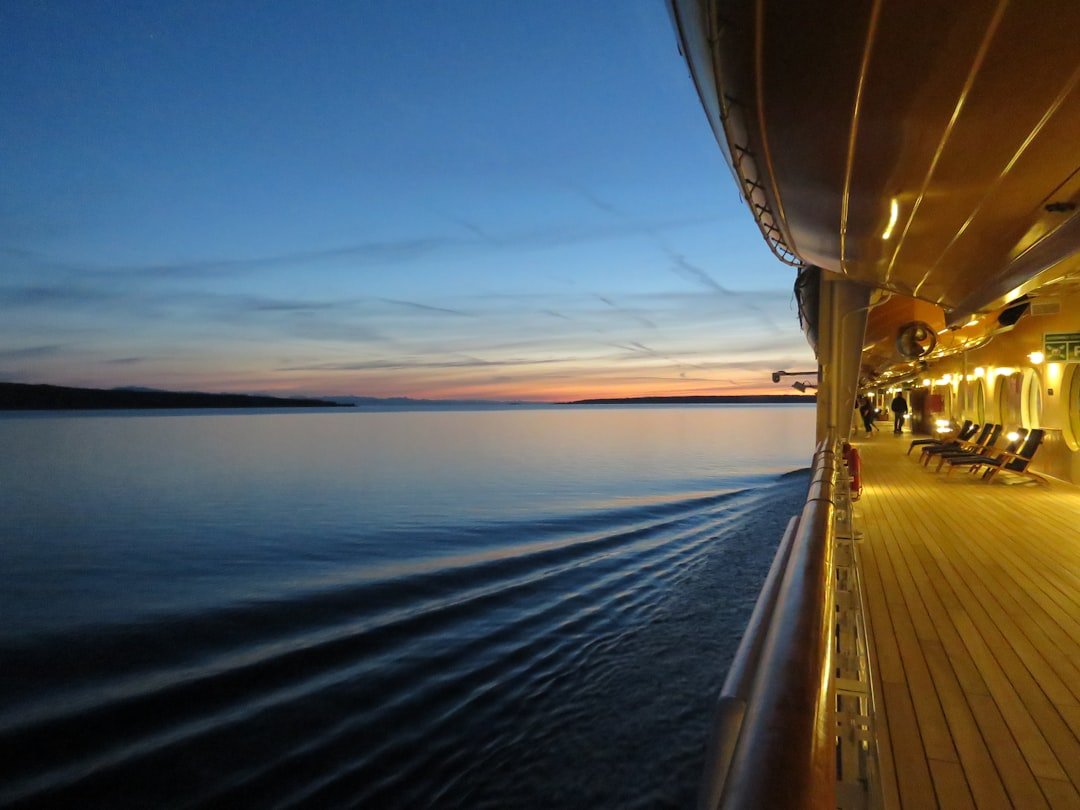 Cruise ship pool deck with lounge chairs at dusk