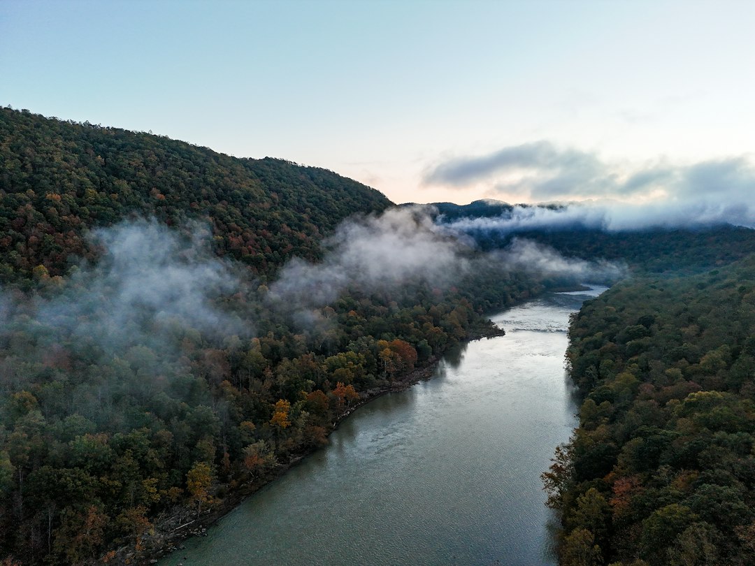 River winding through a forested gorge in autumn