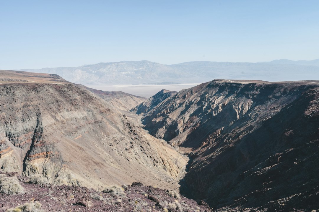 Steep rock walls line the narrow dirt road through Titus Canyon in Death Valley