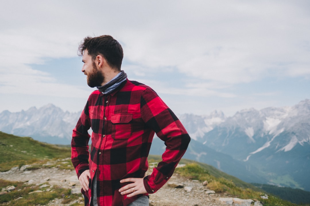 Hiker wearing a long-sleeve shirt on a mountain trail