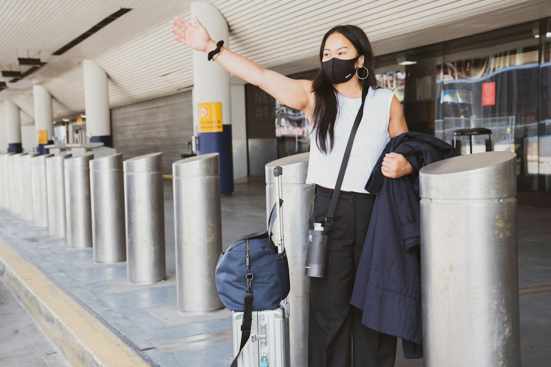 Traveler with luggage arriving at a transit terminal