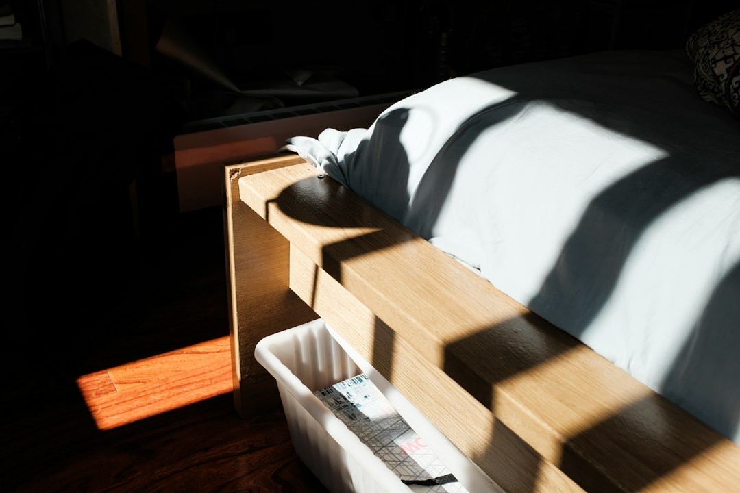 Storage bin tucked neatly under a raised platform