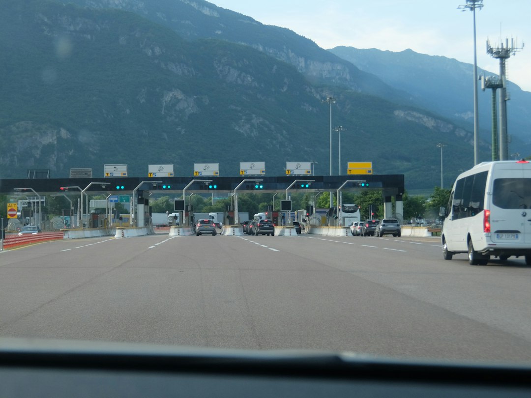 Car approaching an electronic toll plaza on the highway