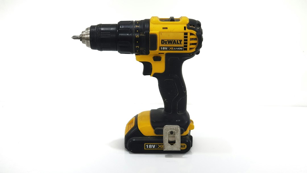 Cordless drill driver standing ready in a workshop