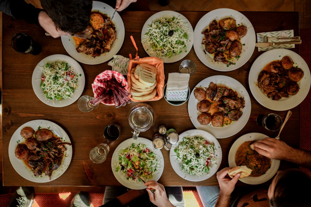 Friends sharing dinner at a restaurant table