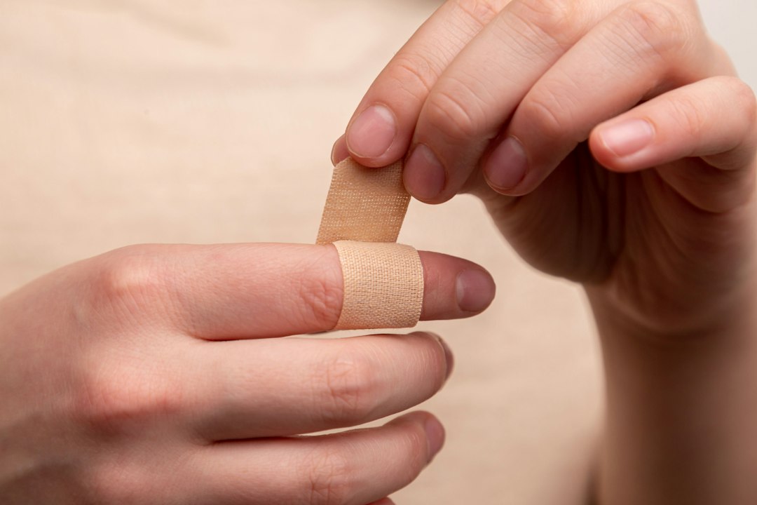 Applying an adhesive bandage
