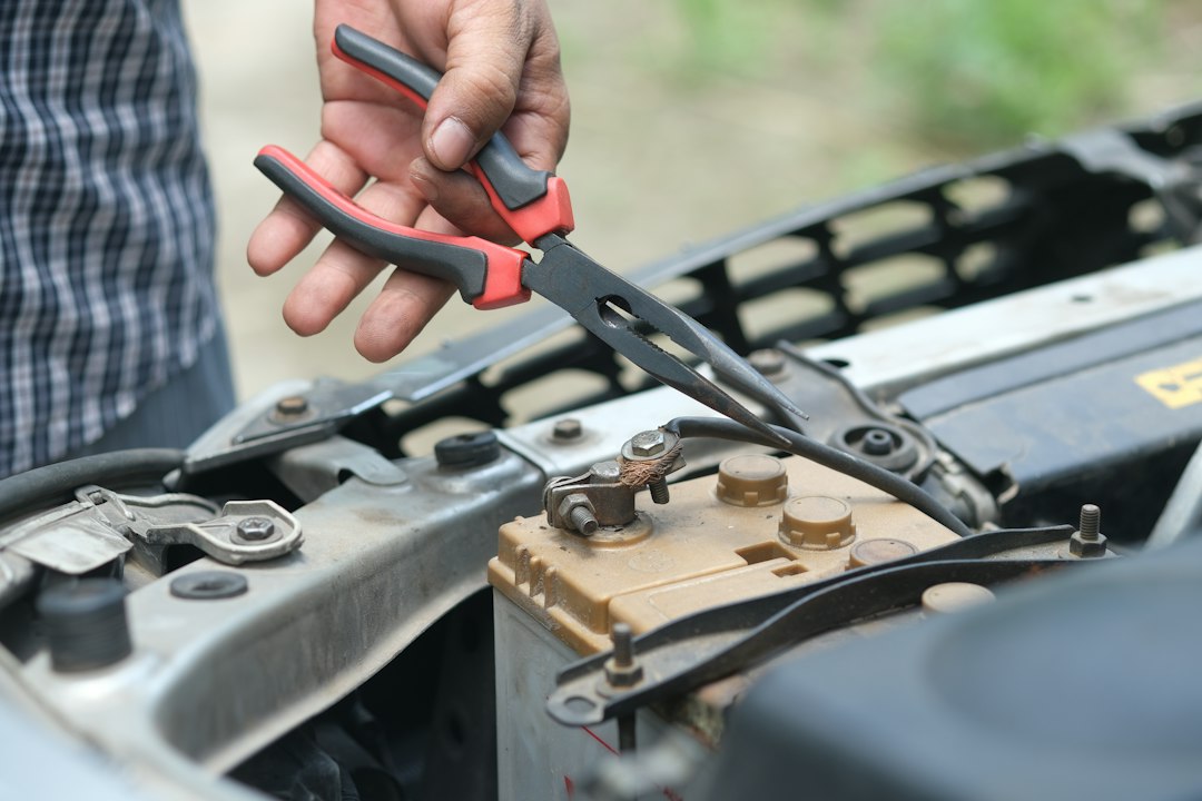 Pliers working in an engine bay