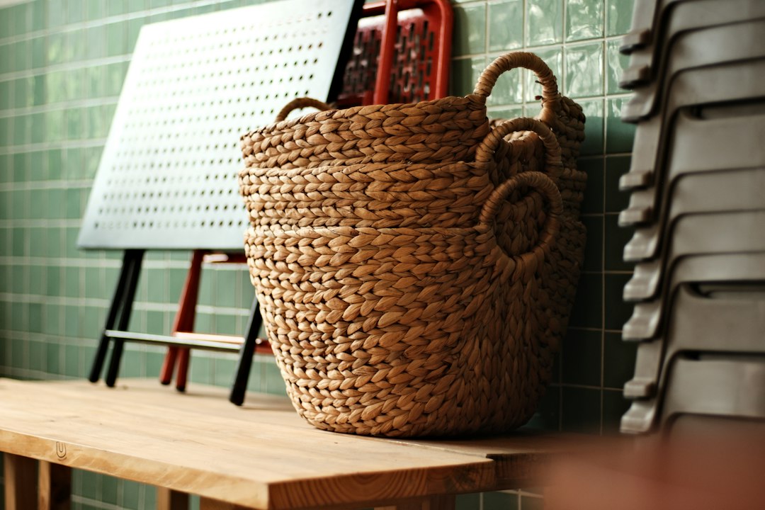 Woven storage basket resting on a wooden bench