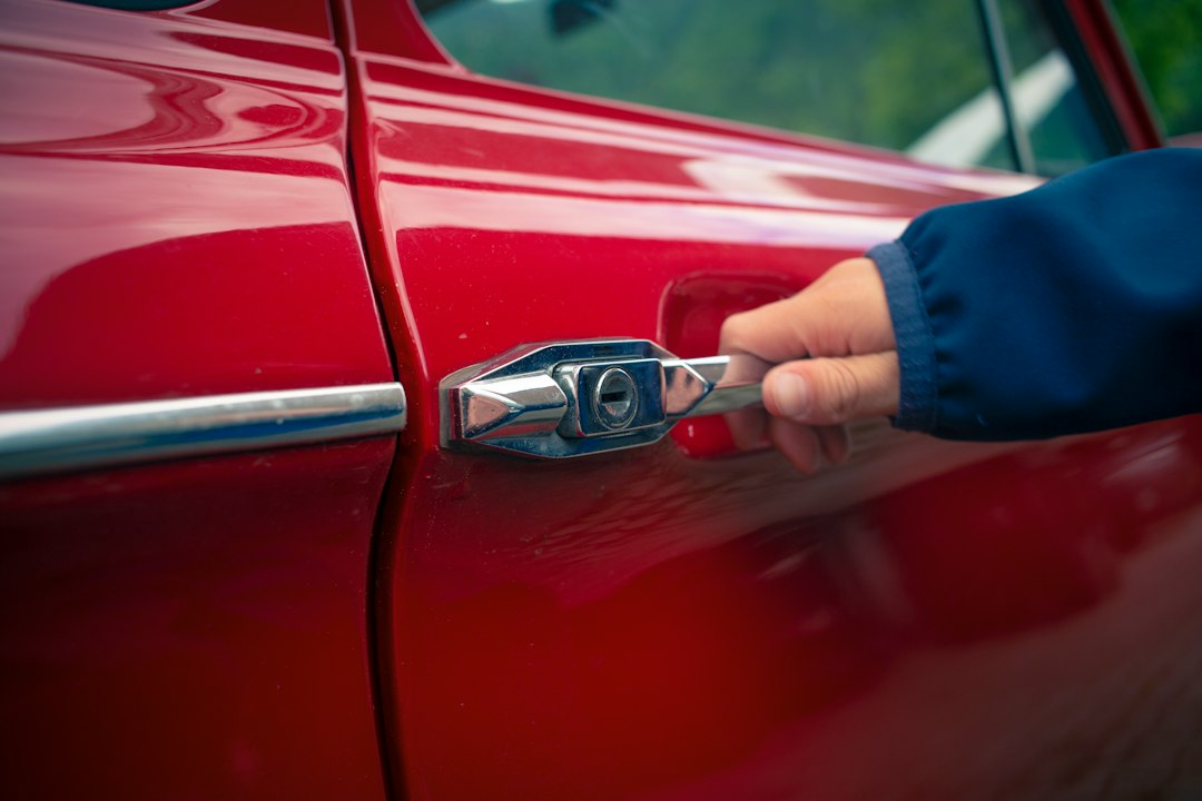 Close inspection of a scratch and dent on a car door panel