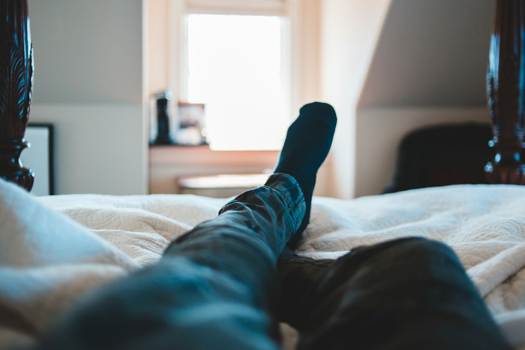 Feet up on a hotel bed at the end of the day