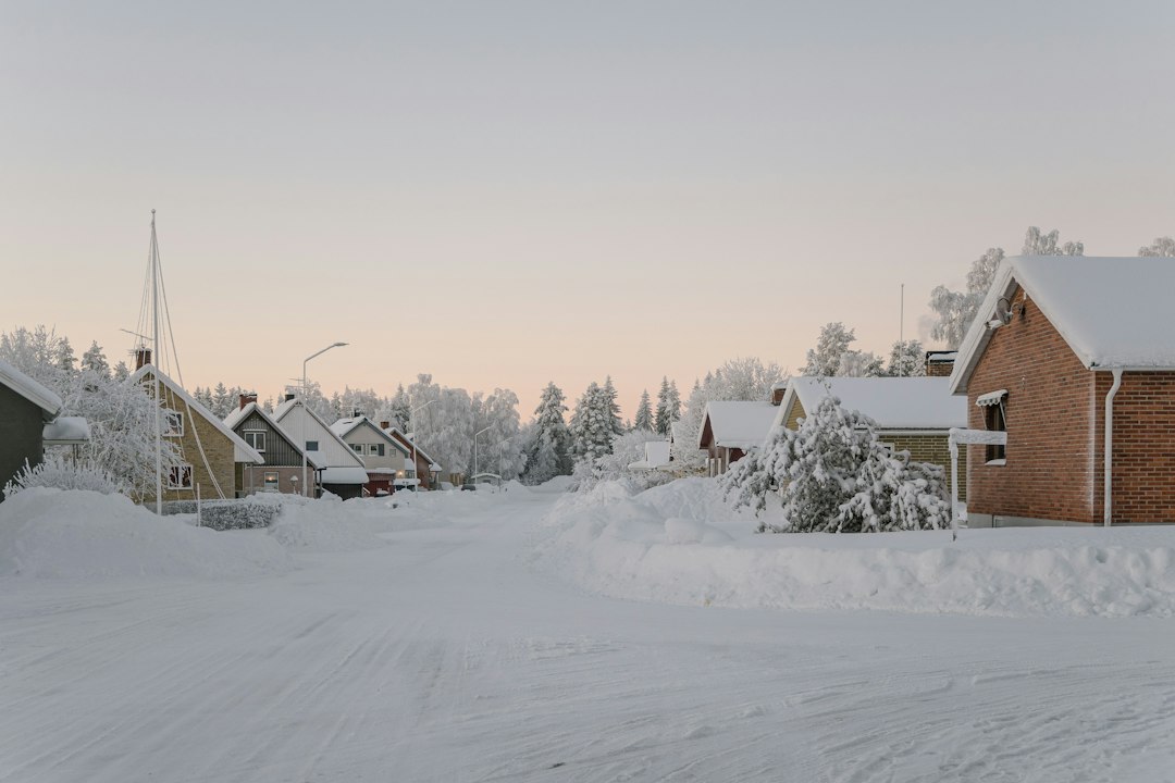 Small northern town under deep snow at dusk