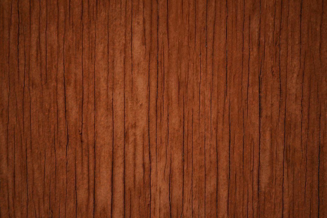 Close-up of warm wood grain on a finished tabletop surface
