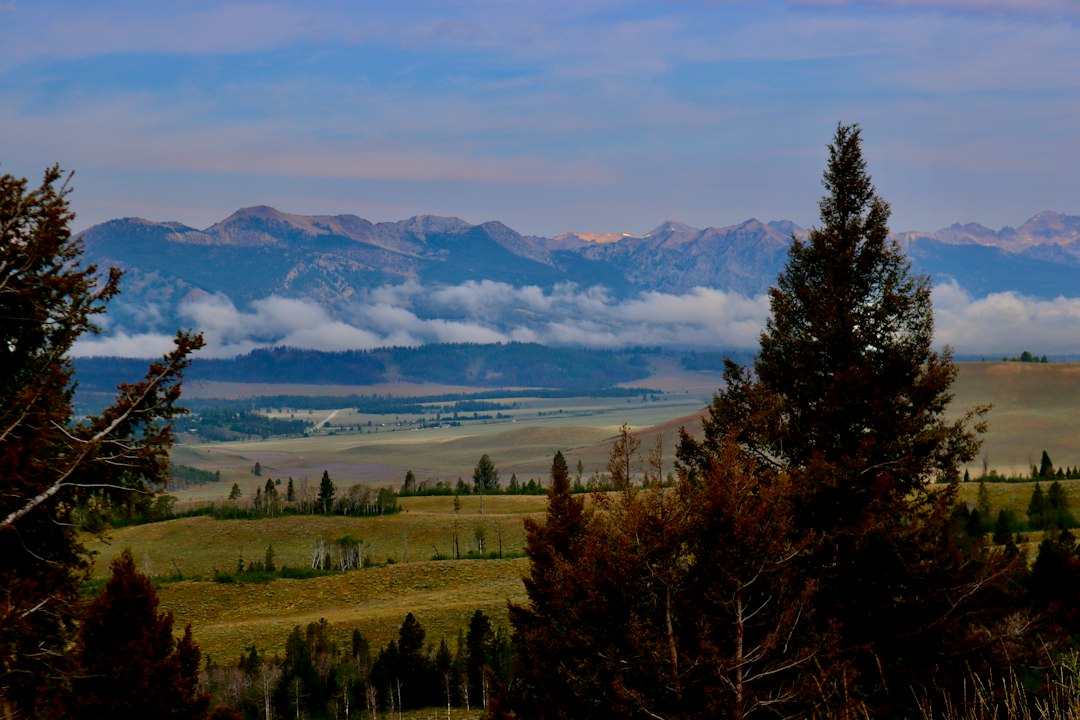 Sawtooth Mountains with fresh snow above a valley in fall