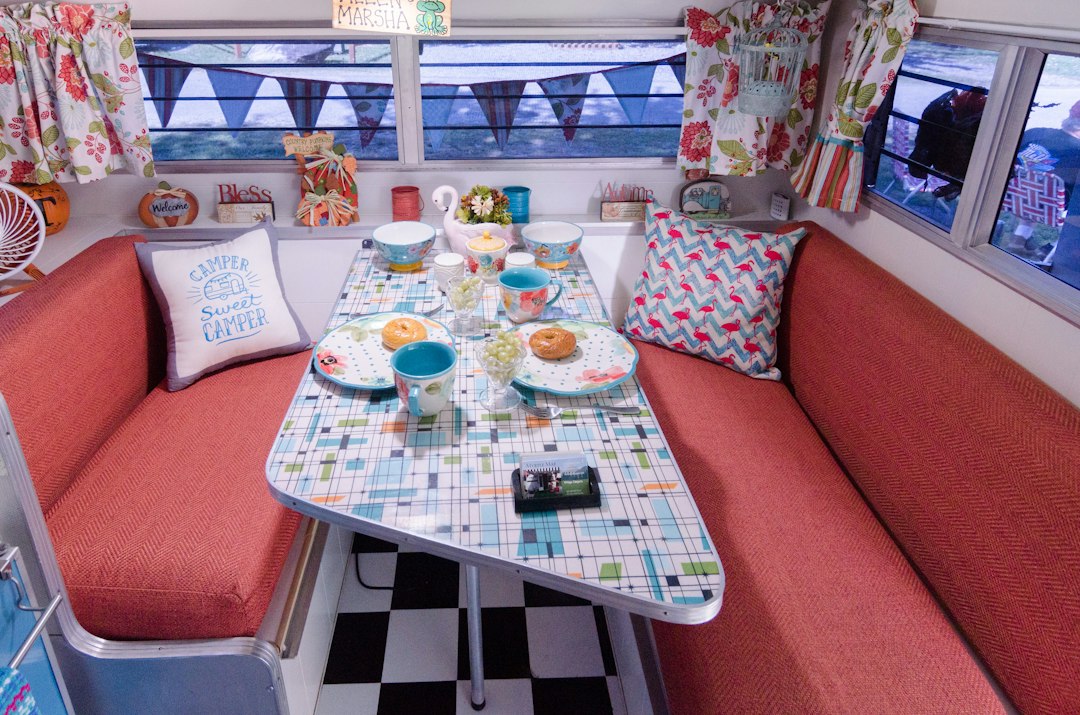 Vintage camper dining nook with upholstered bench seating
